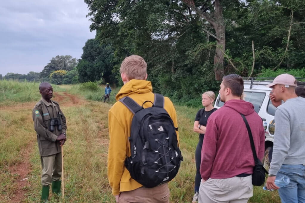 When Is the Best Time to Visit East Africa? Tourists getting instructions before entering Budongo Forest for a Chimpanzee trekking