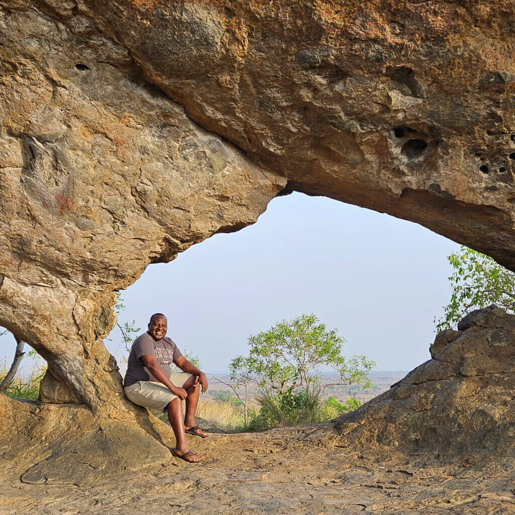 Ema of Ebonjalo Tours at Napadet Cave in the heart of Pian Upe Wildlife Reserve during the 12 day east and northern Uganda Safari Tour