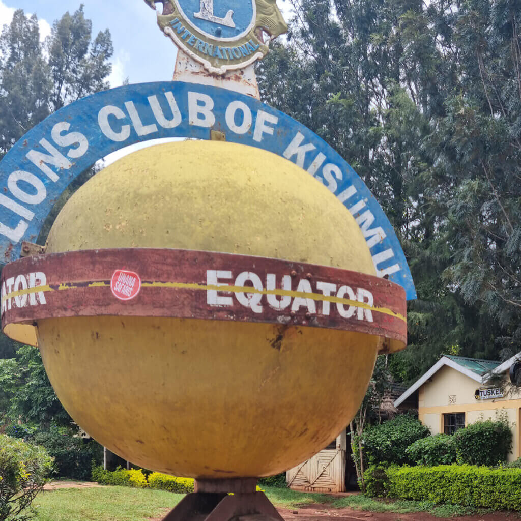12 Day Kenya and Uganda Safari: Masai Mara & Karamoja Signpost of the equator in Maseno Kenya is visited during the Kenya and Uganda safari tour with Ebonjalo Tours